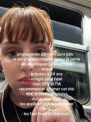A woman with auburn hair is shown in a close-up shot. She is inside what looks like a metro train. The background includes windows and metal framing, creating a sense of confinement. Text overlays on the image list various pet peeves, personal choices, and lifestyle preferences.