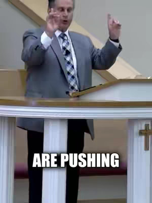 The cover image shows a medium shot of a man speaking at a podium in a church. He wears a grey suit with a patterned tie and is gesturing with both hands. The text overlay at the bottom of the image reads, "ARE PUSHING".