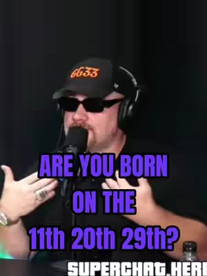 A man wearing sunglasses, a black cap with orange text, and a microphone is positioned in front of a dark background. Text overlaid in purple asks, 'ARE YOU BORN ON THE 11th 20th 29th?'