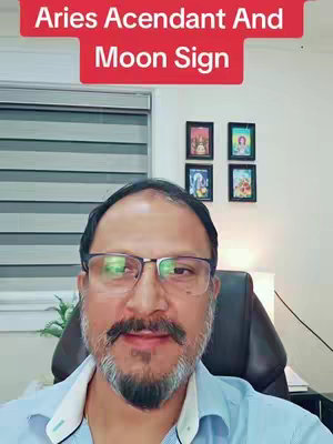 A man with a beard and glasses is centered in the frame. Behind him is a wall with three framed pictures, a window with blinds. The top of the image has a red banner with white text.