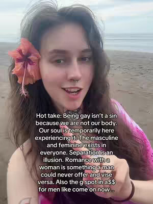 A young woman with long, wavy hair is centered in the frame, posed on a beach. She has a flower tucked behind her ear and is smiling tenderly. Text overlays the image, with text in a casual, easy-to-read font. The background showcases the ocean and sky, with the woman's positioning close to the water, indicating a relaxed setting.