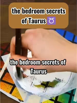 The image shows a person's hand holding a paintbrush and applying white paint to a canvas. Overlayed at the top is a brown rectangle containing the text 'the bedroom secrets of Taurus', with the Taurus zodiac symbol. A similar text overlay appears at the bottom of the image.