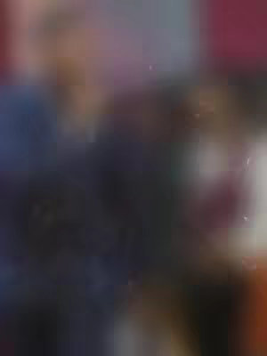 The cover image is heavily blurred with indistinct shapes and colors suggesting a person or figure with a dark background. The colors are mainly dark blues and purples with some lighter areas and a touch of red.