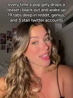 A woman with long, wavy blonde hair is shown from the chest up, slightly angled towards the camera. She has a light complexion, is wearing a simple black top, and a necklace. The background is softly lit and slightly out of focus, with hints of a room.