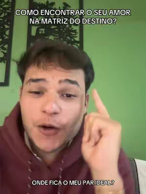 A man with dark hair and a piercing smiles at the camera in front of a green wall. Text overlays at the top and bottom, indicating video content about love and destiny.