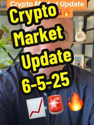A man in a dark blue shirt is centered in a vertical video frame. Overlayed with large, yellow text that reads 'Crypto Market Update 6-5-25'. Below the text is a graph with a rising line, a red siren, and a flame emoji.