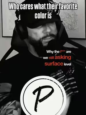 A black and white image featuring a man with a beard and a backwards cap, appearing to be in a podcasting setup. He's speaking into a microphone. Above him is a text overlay that reads "Who cares what their favorite color is". Below, another text overlay challenges basic conversation topics, and a round logo occupies the bottom third.