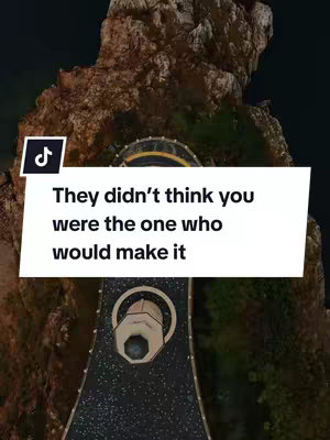 The image shows a digitally created scenic view with a text overlay. The foreground features a pathway, likely intended for a futuristic design, leading through the middle towards a circular structure. Surrounding it are rocky formations with a dark night sky background. A solid white background houses the overlaid text that has black text.