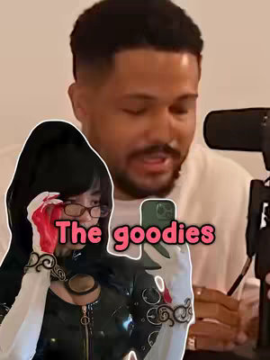 A man is filming with a phone in a room, with a cosplay figure superimposed over part of the image. Text overlayed on the image reads 'The goodies'.