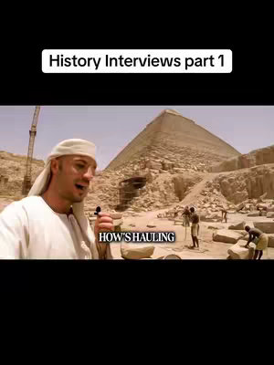 The cover image depicts a man in ancient Egyptian clothing holding a microphone and addressing the camera. Behind him is a background of the Giza pyramids. The scene conveys an interview setting with workers in the frame adding to the context of the historical setting.