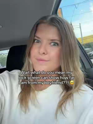 A woman with blonde hair is sitting in a car, looking at the camera with a surprised expression. Text overlays the image.