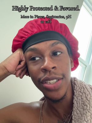 A selfie-style image featuring a person with a red bonnet, looking slightly to the side. The background appears to be a light-colored wall, possibly an interior setting. Text overlays describe astrological details.