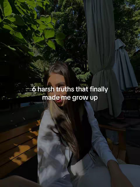 A woman is sitting on a wooden bench outdoors, with trees and a draped cloth in the background. Text overlayed on the image reads "6 harsh truths that finally made me grow up". The image has a natural, slightly desaturated look.