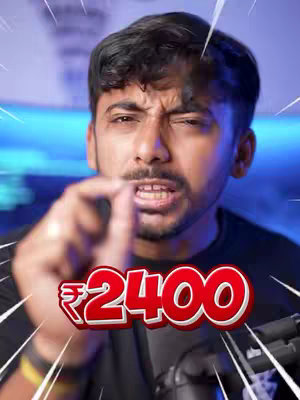 A man with a serious expression points towards the viewer. Behind him is a blue background and added graphics. In the foreground, a red and white text overlay displays the number 2400, likely indicating a monetary amount.