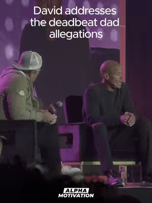 The image features two men seated on a stage. The man on the left is wearing a cap and light-colored jacket while addressing a microphone, and the other man (David) is sitting in a black top and pants. Above them, the video hook appears, overlaid on a purple background. The logo for "ALPHA MOTIVATION" is in the bottom corner.