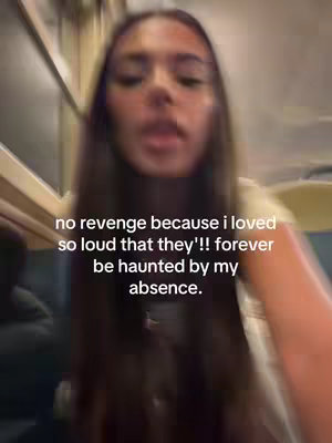 A vertically oriented video cover image featuring a young woman with long, dark hair, looking towards the camera with a serious expression. Text overlayed on the image conveys a message about absence and revenge.