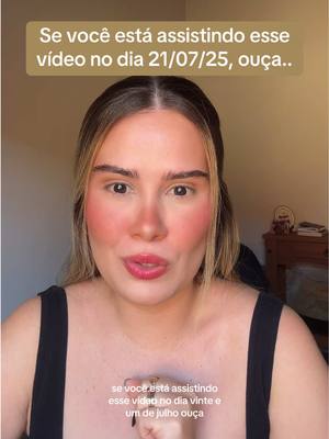 A woman with fair skin, looking directly at the camera with a slight smile, the background is a light brown. A text overlay appears over her head.