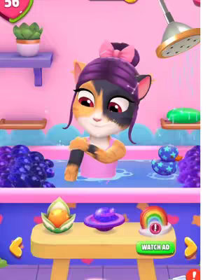 The cover image showcases the character Talking Angela from the game My Talking Angela 2 in a pink and purple bathroom setting. Angela is inside a bathtub, with water and bubbles around her. There's a rubber ducky and other bath toys. Above Angela is a shower head. A shelf with a plant pot and other items is located on the top left.
