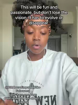 A selfie-style video cover with a woman in the center. She has dark curly hair, a headwrap with a pattern, and is wearing a white sweatshirt. Text overlays are positioned above her and below her.