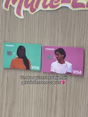 The image shows two Pixpay VISA cards lying on a wooden surface. The card on the left has a green background with a picture of a Black woman wearing an orange shirt. The card on the right has a pink background with a picture of a man with a white shirt. Below those cards there is a writing in french.