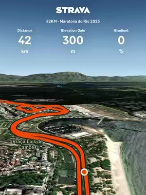 A 3D map-like visual shows the course of the Rio Marathon 2025. An orange line traces the route across a detailed landscape that includes the coastline with beaches and buildings. Overlay text includes Strava branding and race details.