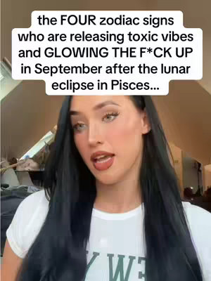 The cover image features a woman with long, dark hair and light eyes, wearing a white t-shirt. She is positioned in the foreground with a neutral background. Text overlayed on the image highlights zodiac signs and astrological themes.