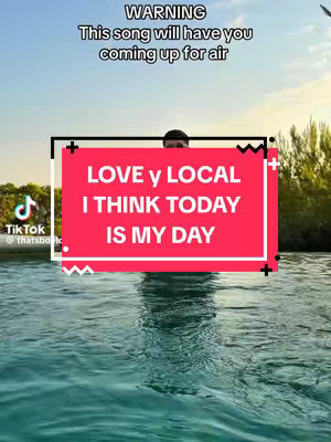 The image is a vertical video cover. The background is a serene view of blue water and a sky with a gradient of colors. A red rectangular box with rounded corners overlays the scene, framing text in the center. The text is white, with the words "LOVE y LOCAL" on the top line and "I THINK TODAY IS MY DAY" below. In the upper left corner there is a Tik Tok logo with its user name @thatsbo  and a warning sign at the top with a text in a white color.