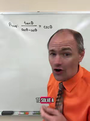 A man with short hair in a bright orange shirt and a patterned tie stands in front of a whiteboard with a math equation written on it. The man is looking directly at the camera with his mouth open, as if he's talking.