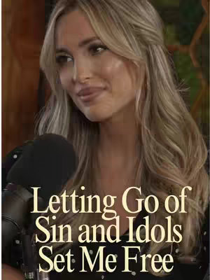 A woman with long blonde hair and a gentle smile is positioned slightly off-center. She holds a microphone. Overlayed text near the bottom reads 'Letting Go of Sin and Idols Set Me Free' in a yellow-gold color, with a shadow effect. The overall tone suggests a podcast or talk show.