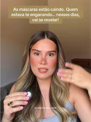 A woman with long blonde hair looks directly at the camera. The background is a plain cream-colored wall. She is holding something up in her left hand. Text is overlaid in a box over the woman.