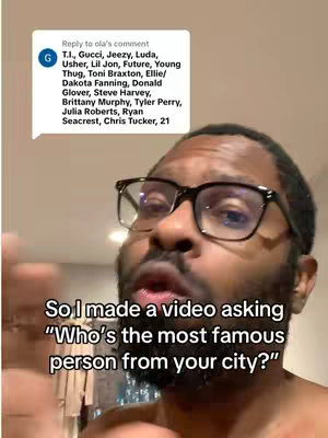 A man with glasses is looking at the camera and speaking. There is a speech bubble to his left with a list of names believed to be the most famous in Atlanta. In the bottom center of the image, there is a text overlay asking a question, and behind him, a wall and what appears to be clothing hung on a rack.