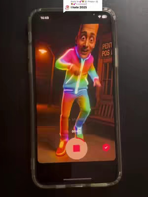 A phone screen displays a video of an AI-generated character with a long forehead and a colorful outfit dancing inside the phone's frame. An iPhone, held vertically, shows the video within its screen; a red record button and a checkmark icon are visible in the lower part of the screen.