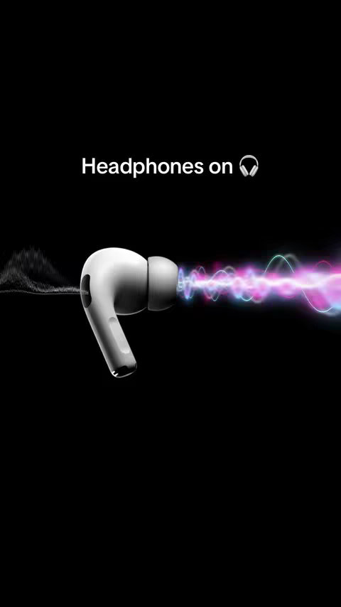 A product shot featuring a pair of white Apple AirPods Pro. The earbuds are positioned in the center against a solid black background. Emanating from the right earpiece are stylized, colorful sound waves in shades of purple, pink, blue, and green. The text'Headphones on' is displayed in white above the earbuds.