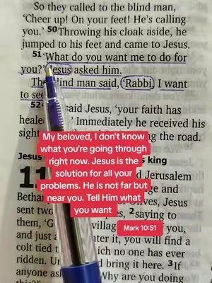 A close-up shot of an open book featuring highlighted biblical text with a blue pen partially obscuring the view. overlaid on top is a text box with a message.