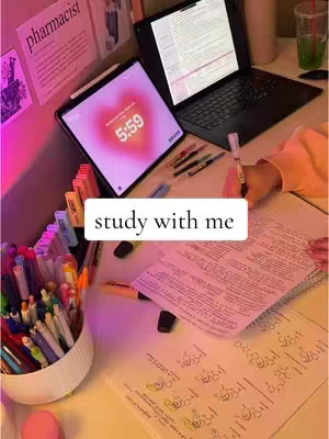 The cover image shows a well-lit workspace. A laptop and an iPad are visible with active screens. The iPad displays a heart-shaped gradient over a clock. Pens and highlighters fill a container. A hand with a pen is writing on a paper.