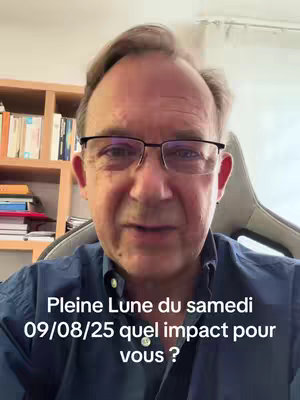 A man with glasses is the central focus, positioned against a background that includes a bookshelf filled with books. The man is looking directly at the camera and speaking. Text overlays at the bottom describe the video's topic, including the date and subject matter. The overall lighting is relatively soft and even.