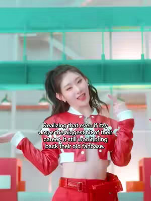 The cover image shows a young woman in a red jacket and skirt, posing in a brightly lit studio. She's smiling and making a gesture with her fingers, against a background of teal and red elements. Text overlays the image.