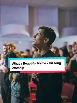 The image shows a man singing in a brightly lit indoor setting, likely a worship service. His eyes are closed and his face is turned upwards, expressing emotion. A text overlay in a colored box identifies the song.