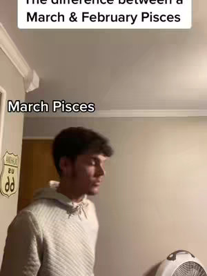 A man is standing in a room with a white hoodie on. Text overlays read, "The difference between March & February Pisces" and "March Pisces."
