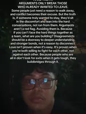 A person with glasses looks into the camera, a text overlay on top with motivational message.