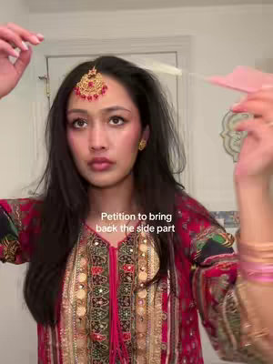 A young woman with a traditional Indian headpiece and ornate blouse is shown. The background indicates a bathroom setting. Text overlayed is a call to bring side parts back.