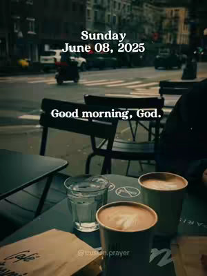 An outdoor cafe scene with a blurry cityscape in the background. At the bottom, on a table, are two cups of coffee with latte art, a glass of water, and a paper bag with 'Cafe' written on it. Overhead is a text overlay with the date.