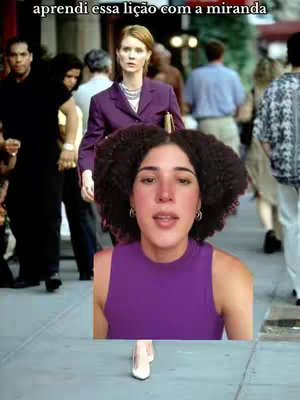 The cover image shows a woman with curly hair in the foreground speaking, with a scene from the TV show "Sex and the City" as a backdrop. In the background, the actress playing Miranda is visible, alongside various extras on a city street. Overlay text is displayed at the top of the image.