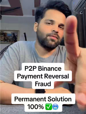 A man in a grey t-shirt points towards the camera. Overlayed text declares the video's topic: "P2P Binance Payment Reversal Fraud", with a subtitle "Permanent Solution 100%" below it, accompanied by check and face mask emojis.