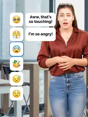 A woman stands in front of a simple, light-colored background. To her left, a series of emojis are displayed, each associated with a different emotion. Text boxes are positioned above, with associated sentences, suggesting a lesson on emotional expression.