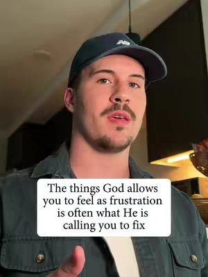 A medium shot shows a man with light skin and a neatly groomed mustache and goatee wearing a dark blue baseball cap and a gray button-up shirt. He is looking directly at the camera with a slight smile. A white rectangular text box in the lower portion of the frame contains the video's text overlay.