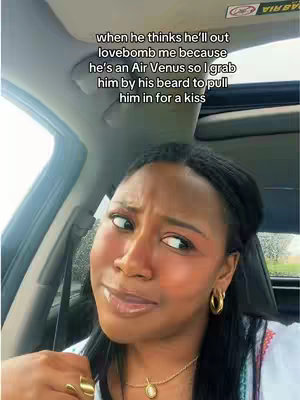 A woman with braids and gold hoop earrings sits in a car, looking sideways with a slightly amused and questioning expression. Text overlays the image.
