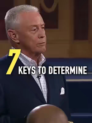 A man in a navy suit is looking to the left. The words '7 KEYS TO DETERMINE' are overlaid in yellow and white text.