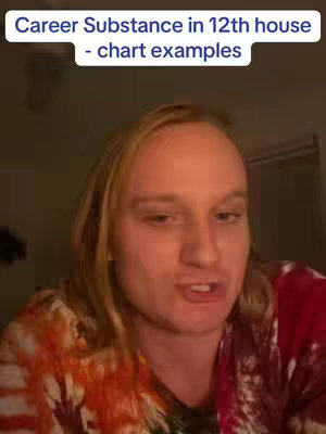 A selfie-style video cover image shows a person with blonde hair, wearing a colorful tie-dye shirt, talking to the camera. Text overlay at the top indicates the video's topic: Career Substance in 12th house - chart examples. The background is dim, likely indoors.