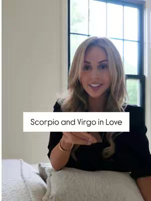 The cover image features a woman with long blonde hair, sitting and smiling. She's wearing a black top and a gold bracelet. Text overlayed on the image says, 'Scorpio and Virgo in Love'. The background includes a window and a neutral-colored wall.
